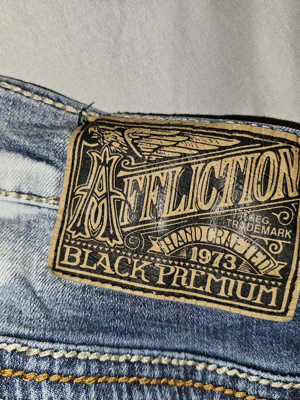 Affliction Men’s Light Blue Denim Jeans with Branded Leather Patch